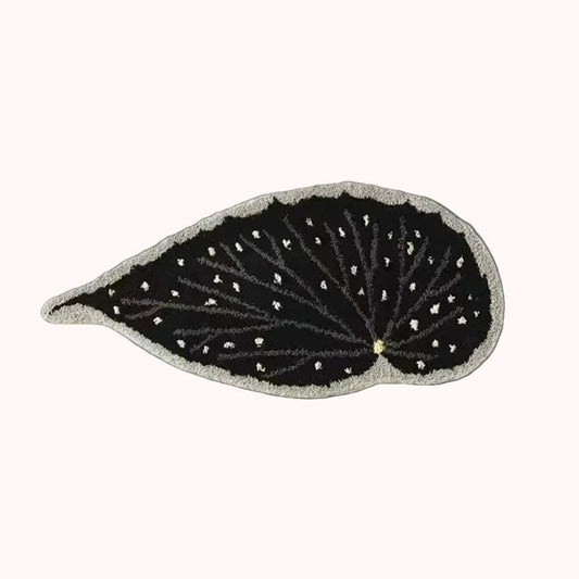 Black leaf-shaped patch with white detailing on a white background