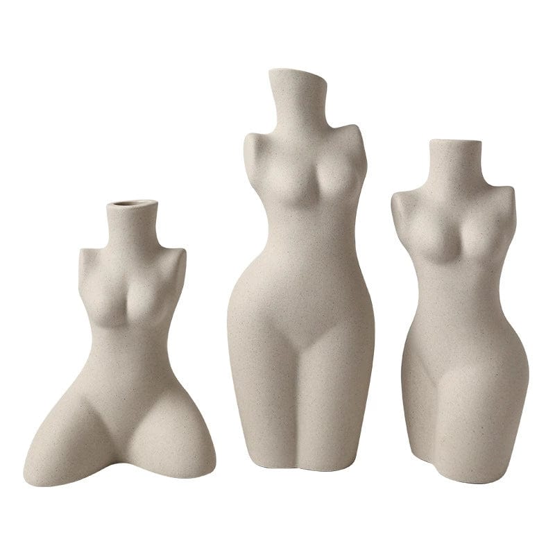 Set of three beige ceramic body shaped vases with smooth sculpted surfaces and neck openings for floral display