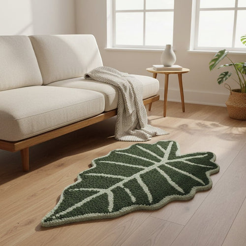 Green alocasia plant leaf rug with white vein detailing and soft plush texture for cozy floor decor