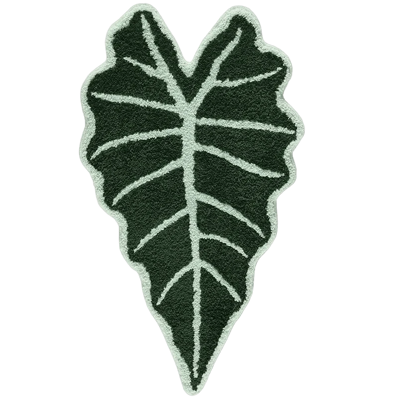 Dark green plush alocasia plant leaf rug with light green vein detailing for cozy home decor
