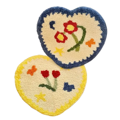 Heart-shaped rug with floral design on a textured surface