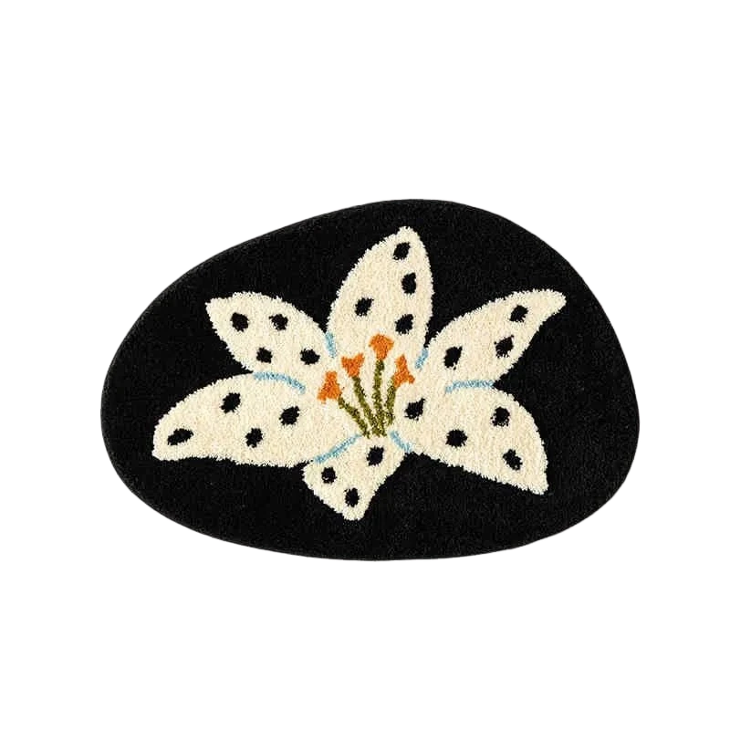 Decorative mat with a white flower design on a black background