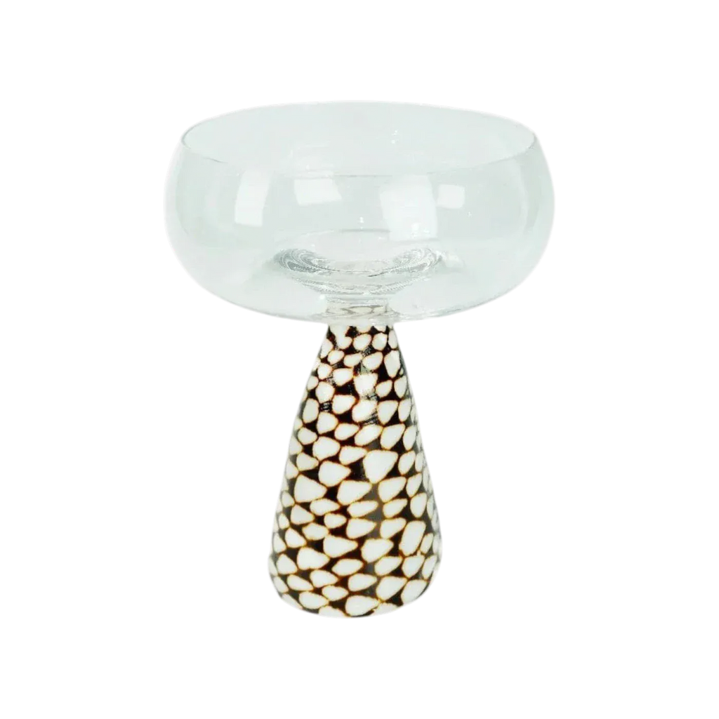 Conch shell coupe glass translucent mushroom-shaped bowl with patterned black and cream teardrop-shaped base