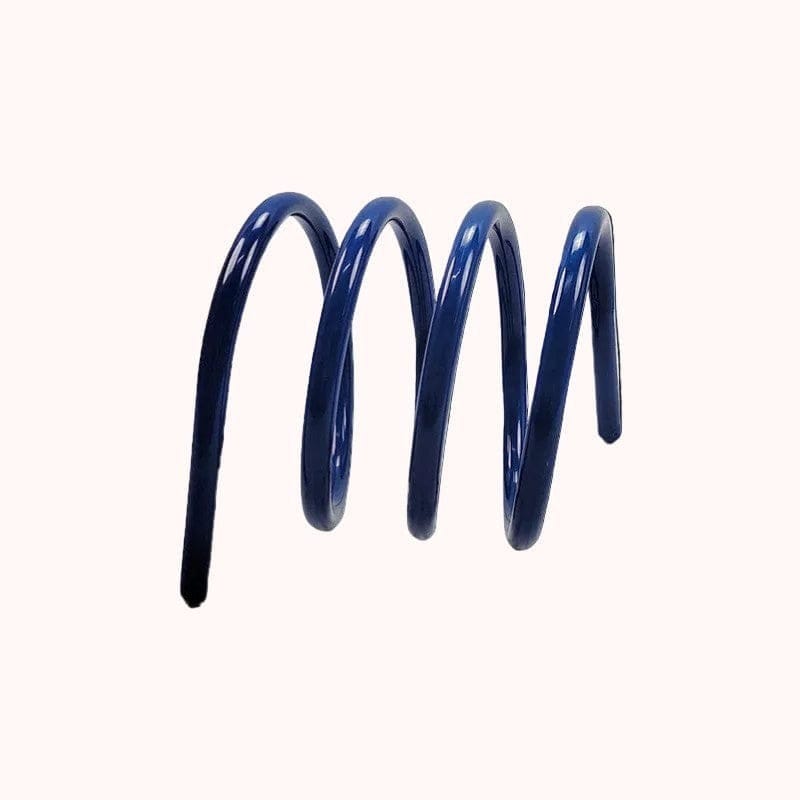 A glossy navy blue metal coil spring designed as a spring book holder for securing open books