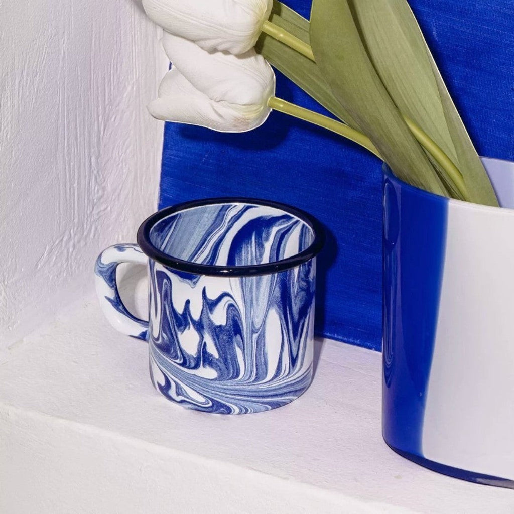 HOMELIVY retro ceramic mug with marbled blue and white pattern and black rim. Perfect for coffee or tea.