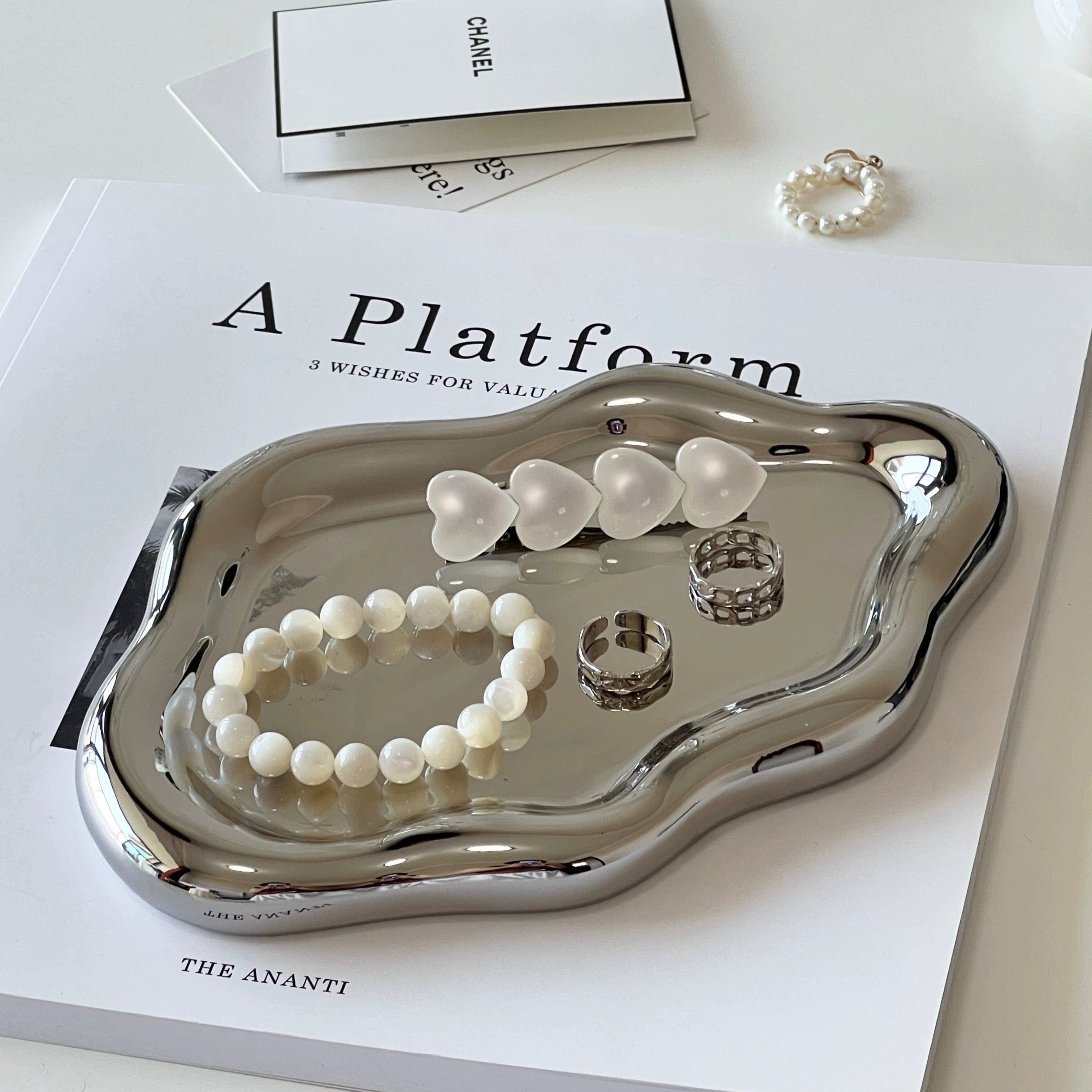 Ceramic cloud tray in shiny silver metal with smooth wavy edge design for stylish serving and decor