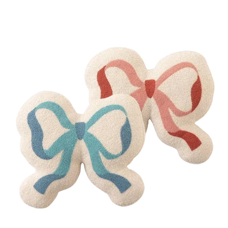 HOMELIVY ribbon bow pillows in cream with blue and pink ribbon details. Soft textured cushions for decor.