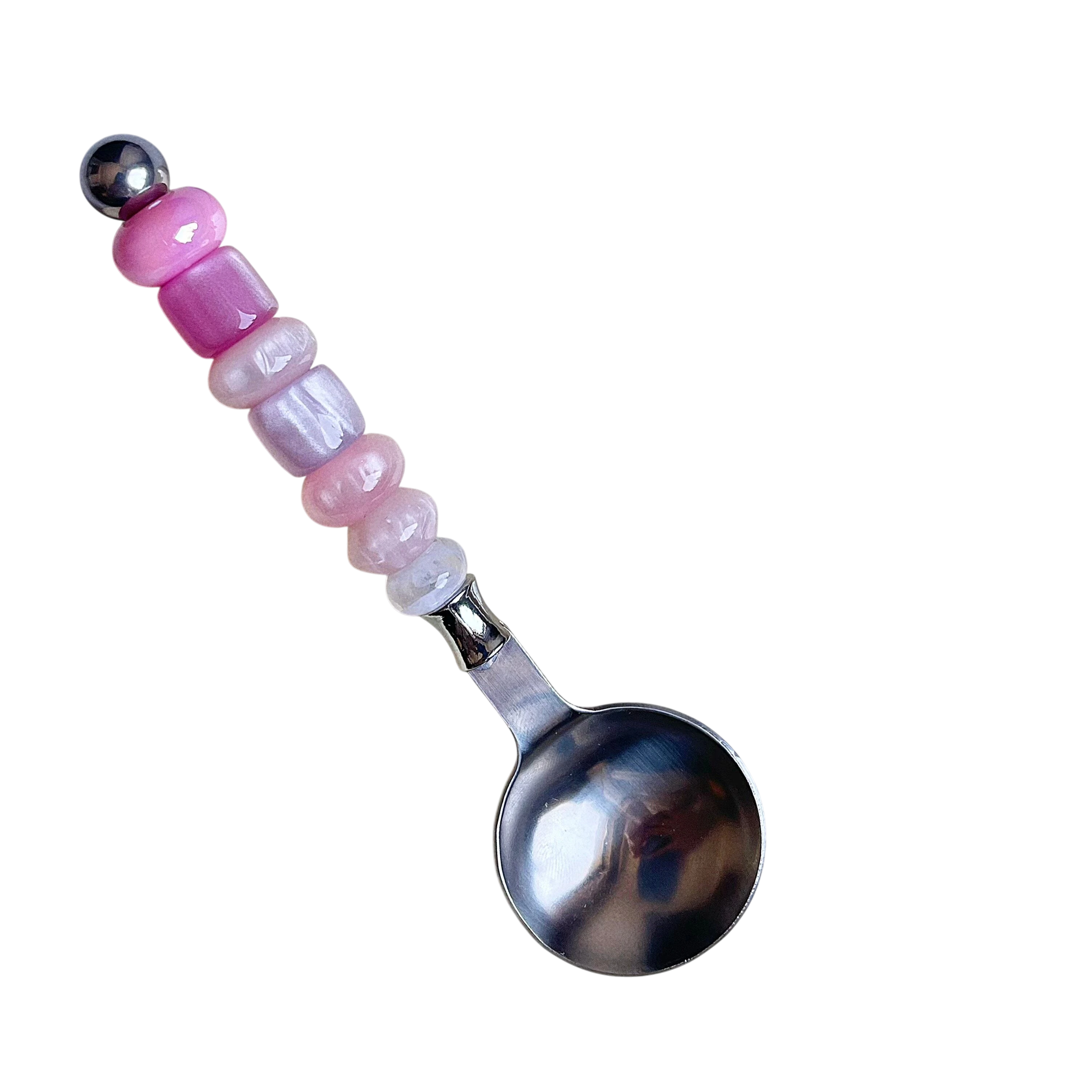 HOMELIVY stainless steel spoon featuring a decorative handle with pink and iridescent beads on a black background.