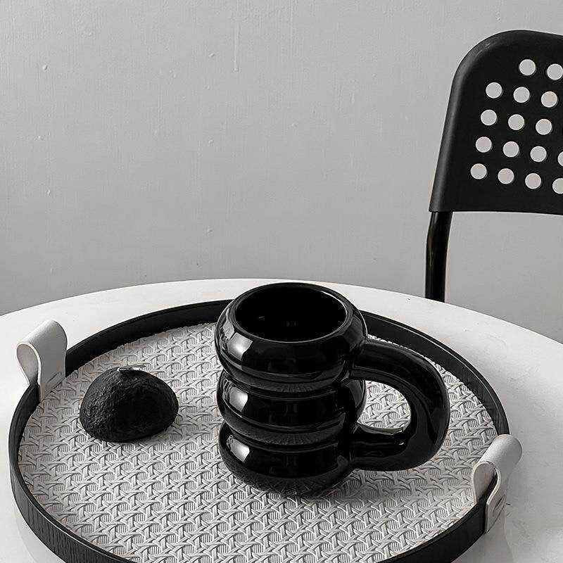 HOMELIVY black ceramic bubble coffee mug with sculptural stacked rings and oversized handle, 350ml capacity.