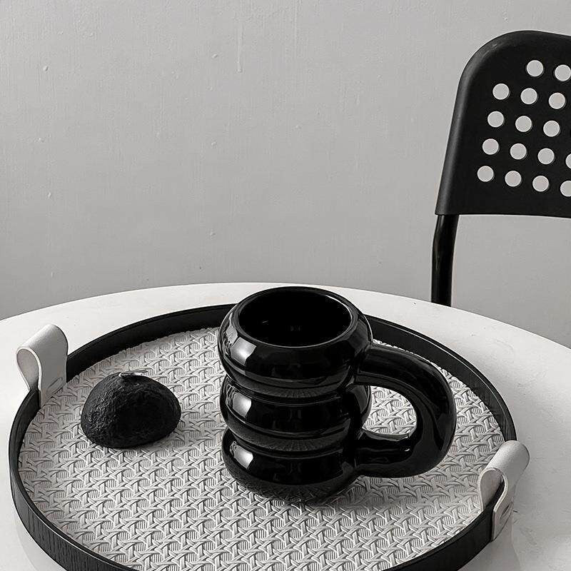 HOMELIVY black ceramic bubble coffee mug with sculptural stacked rings and oversized handle, 350ml capacity.
