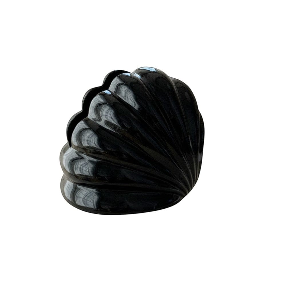 Glossy black seashell tissue holder with smooth reflective surface and subtle ridges along curved edges