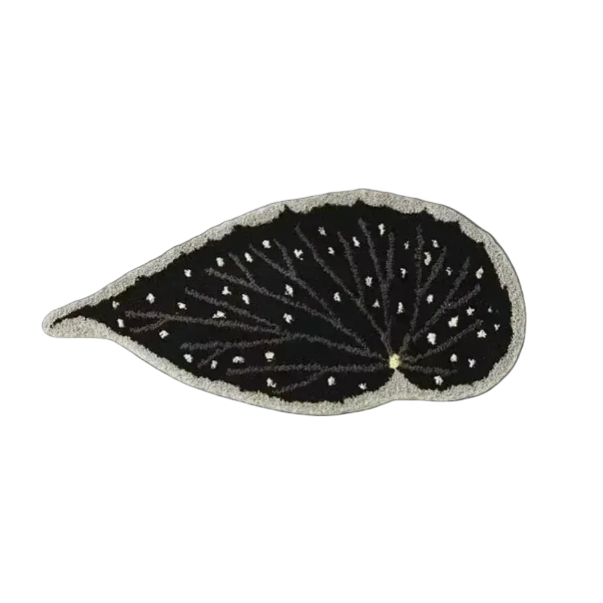 Black leaf-shaped patch with white detailing on a white background