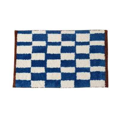 HOMELIVY retro blue and white checkered bath mat with brown trim. Soft shag texture.