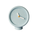 HOMELIVY powder blue minimalist desk clock with white hands and yellow center on pedestal base.