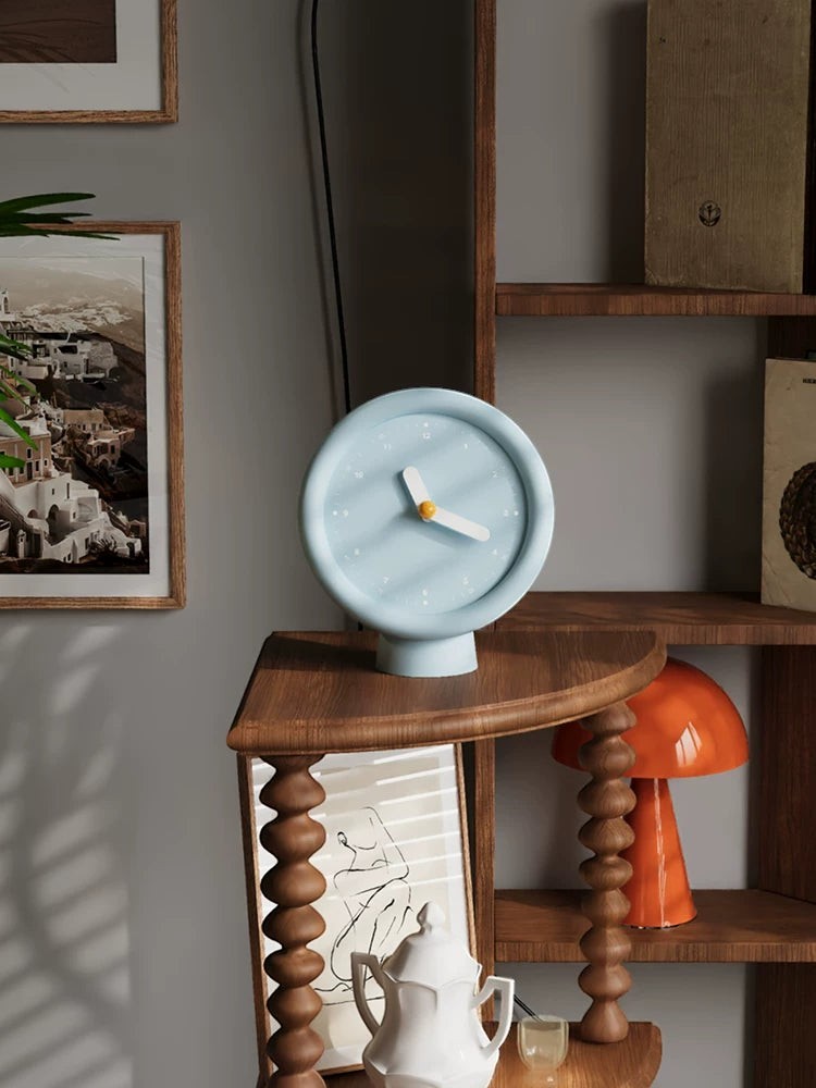 HOMELIVY powder blue minimalist desk clock with white hands on a pedestal base, perfect for aesthetic desk setups.