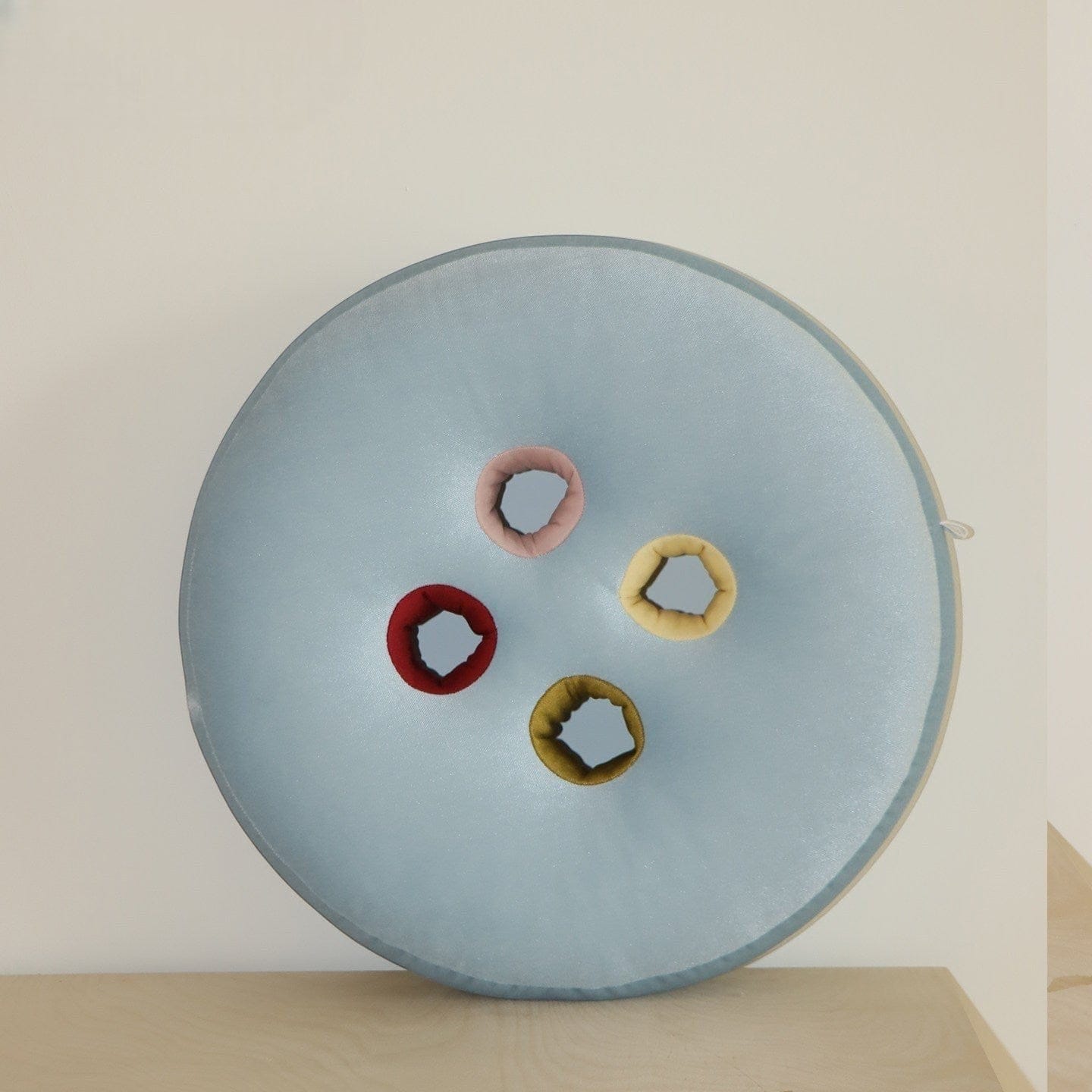 HOMELIVY light blue velvet round seat cushion with four colorful button inserts: pink, red, yellow, and olive green.