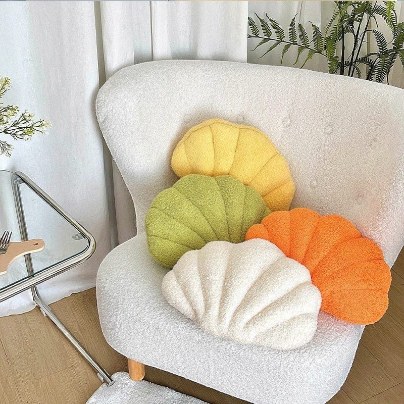 HOMELIVY Bouclé shell-shaped throw pillow in cream, green, yellow, and orange. Coastal decor accent.