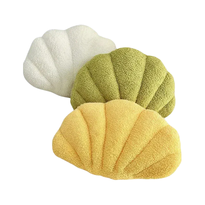 HOMELIVY Bouclé shell shaped cushion in yellow, green, and white. Soft, textured throw pillow for coastal decor.