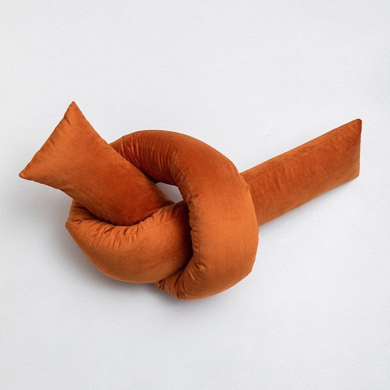 HOMELIVY burnt orange velvet knot cushion, sculptural design, soft suede-like texture.