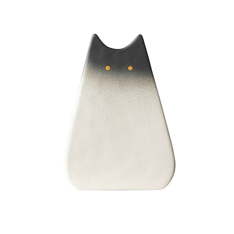 HOMELIVY minimalist cat-shaped ceramic vase with a black-to-white gradient finish and two small yellow dot eyes.
