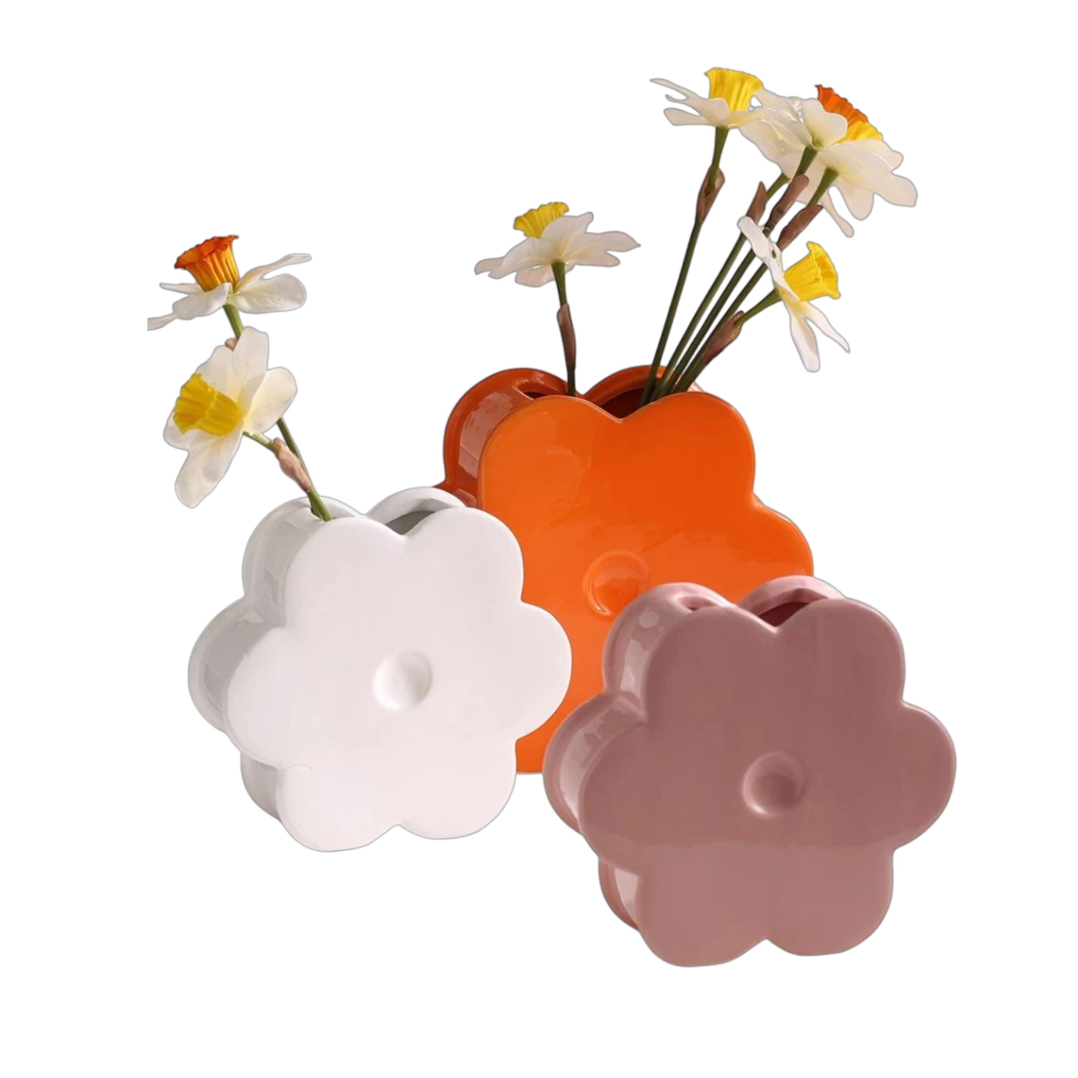 HOMELIVY ceramic flower shaped vases in white, orange, and pink, each holding a single daffodil on a white table.