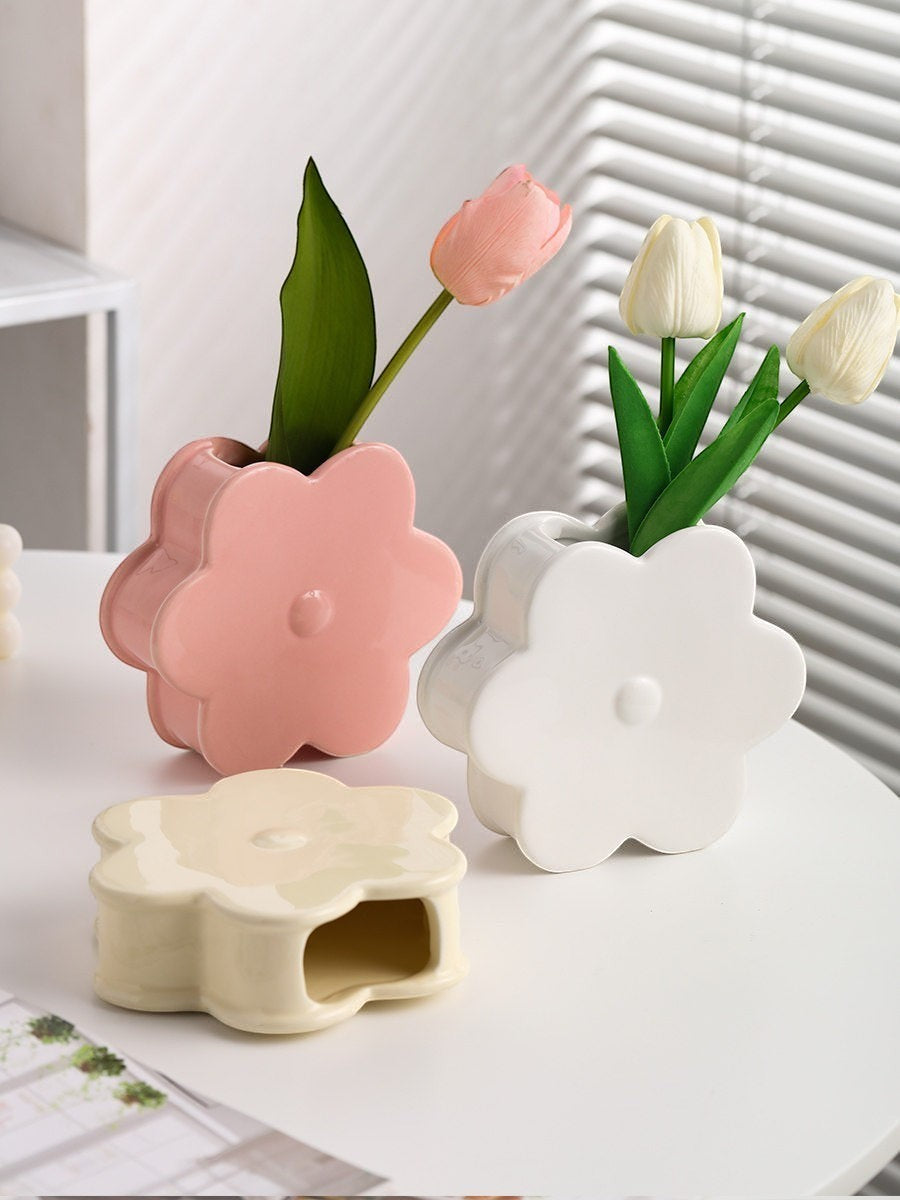 HOMELIVY ceramic flower-shaped vases in pastel pink, white, and cream on a white table with artificial tulips.