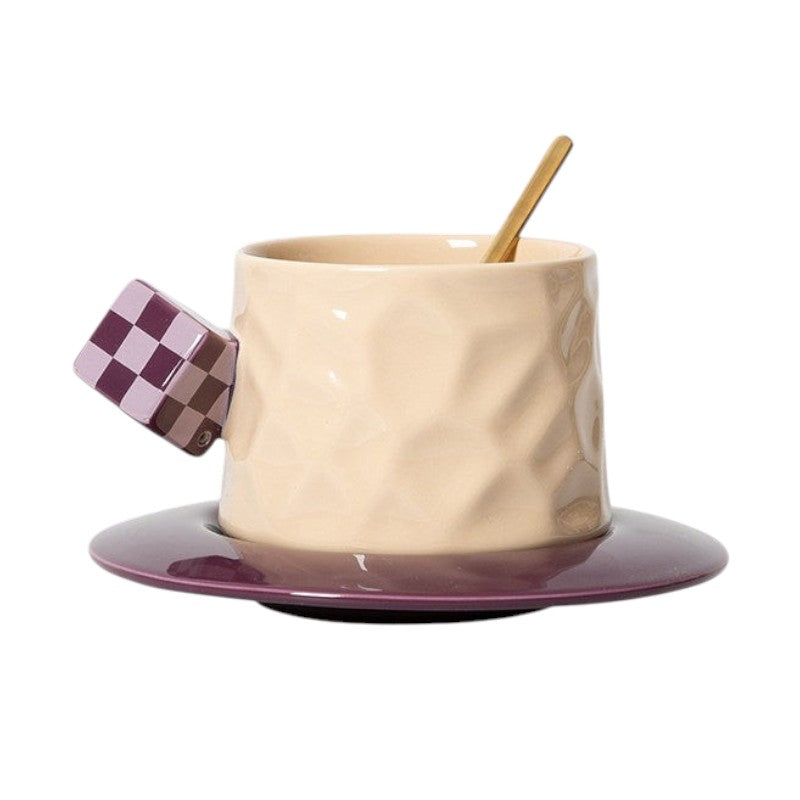 HOMELIVY beige ceramic mug with a purple checkerboard cube handle and matching purple saucer