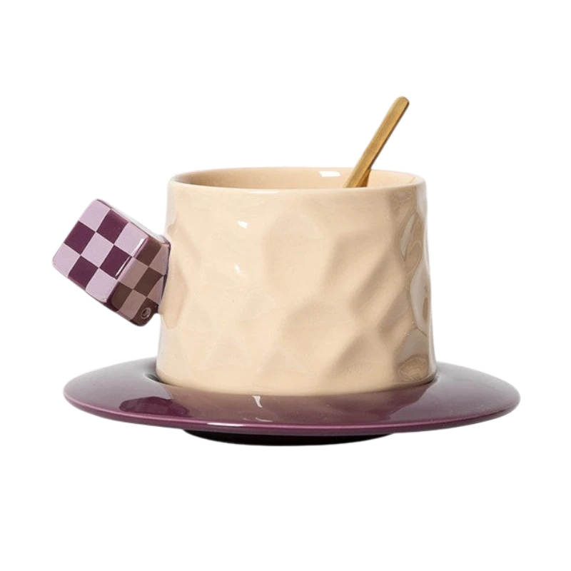 HOMELIVY beige ceramic mug with a textured surface, purple checkerboard cube handle, and matching purple saucer.