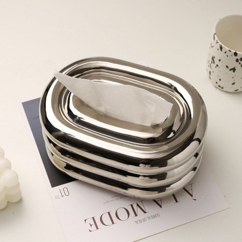 HOMELIVY chrome tissue box holder with a retro bubble form, oval shape, and ribbed design. Perfect for desks and shelves.
