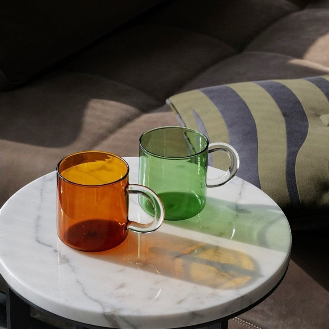 HOMELIVY Color Block Retro Glass Mug in amber and green, clear glass handle, cylindrical shape, perfect for beverages.