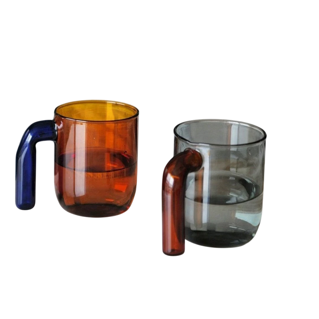 HOMELIVY color block retro glass mug with amber body, blue handle, and yellow rim, next to a grey mug with a brown handle.