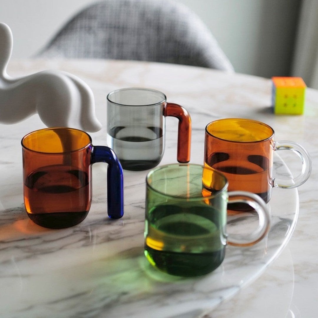 HOMELIVY Color Block Retro Glass Mugs in amber, green, grey, and orange with contrasting handles.