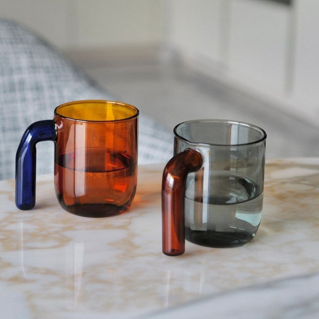 HOMELIVY Color Block Retro Glass Mug with blue handle and amber rim, and a grey mug with a brown handle.