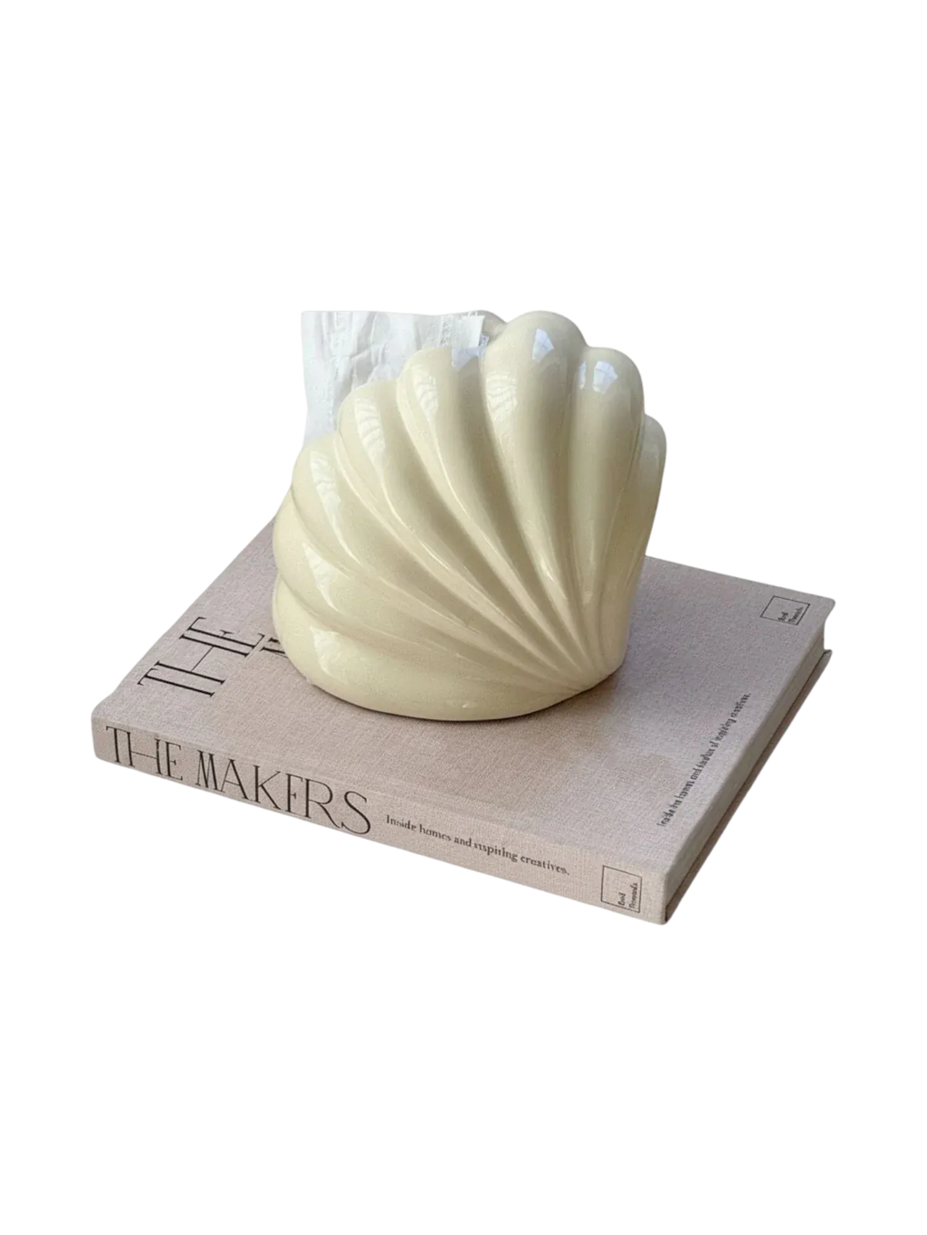 Cream-colored ceramic shell tissue holder with smooth glossy finish and ridged seashell texture for decor use