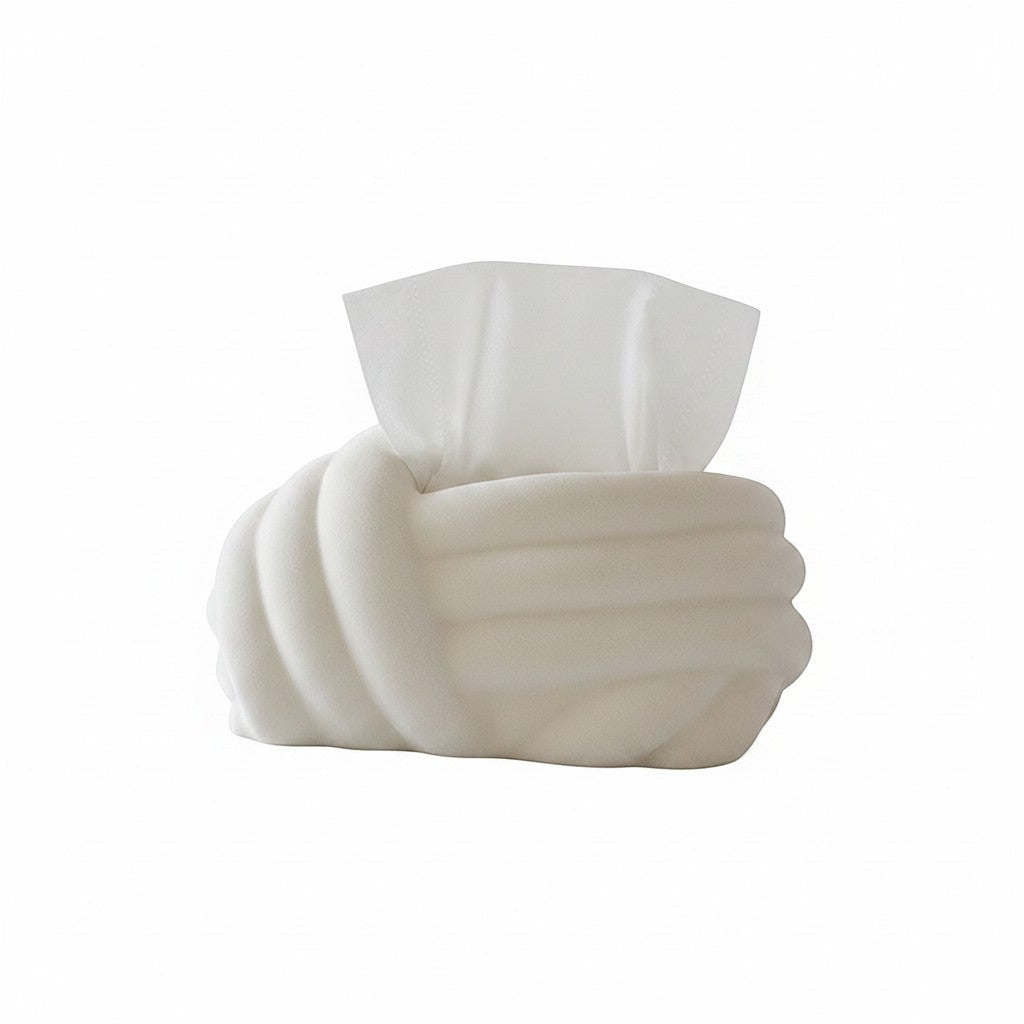 HOMELIVY cream white ceramic tissue box cover with sculptural knot design. A hand is shown pulling a tissue.