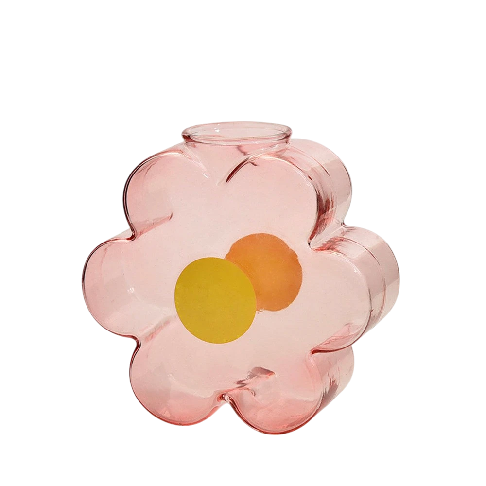 HOMELIVY pink translucent glass flower-shaped vase with yellow and orange circular accents on a black background.