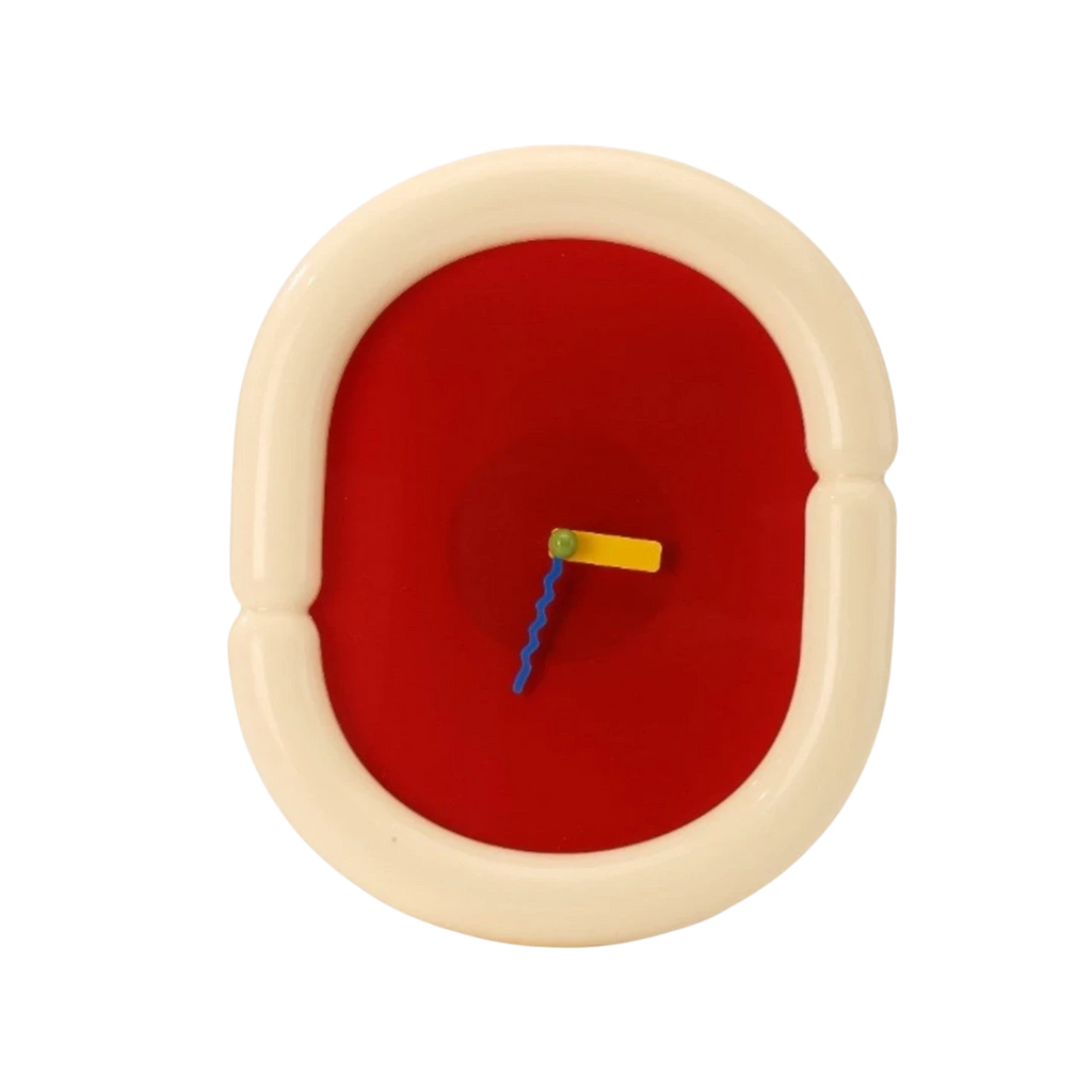 HOMELIVY sculptural wall clock with chunky cream frame, bold red face, and multicolored hands. A statement piece for eclectic decor.
