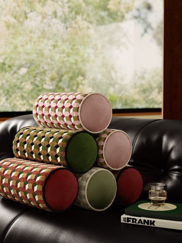 HOMELIVY geometric print bolster cushion in pink, green, and burgundy with solid pink ends.