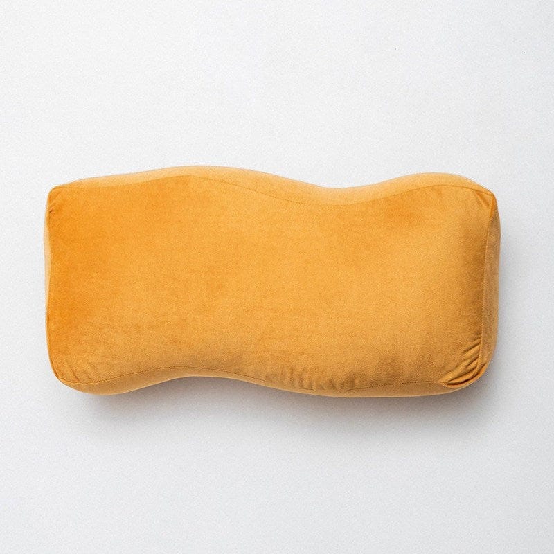 HOMELIVY warm gold velvet bolster cushion with a soft suede-like finish and sculptural shape.