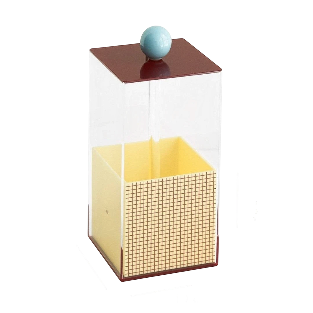 HOMELIVY Quirky Memphis acrylic brush holder with geometric grid pattern, yellow interior, and light blue knob on maroon lid.