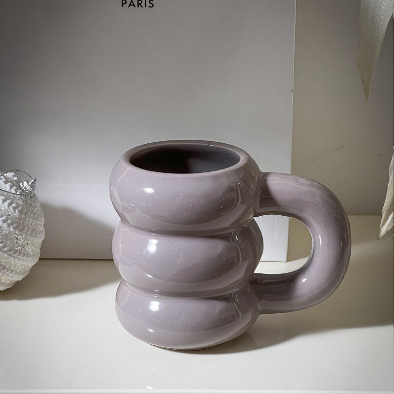 HOMELIVY Nordic Sculptural Bubble Coffee Mug in light purple ceramic with stacked ring design and oversized handle.