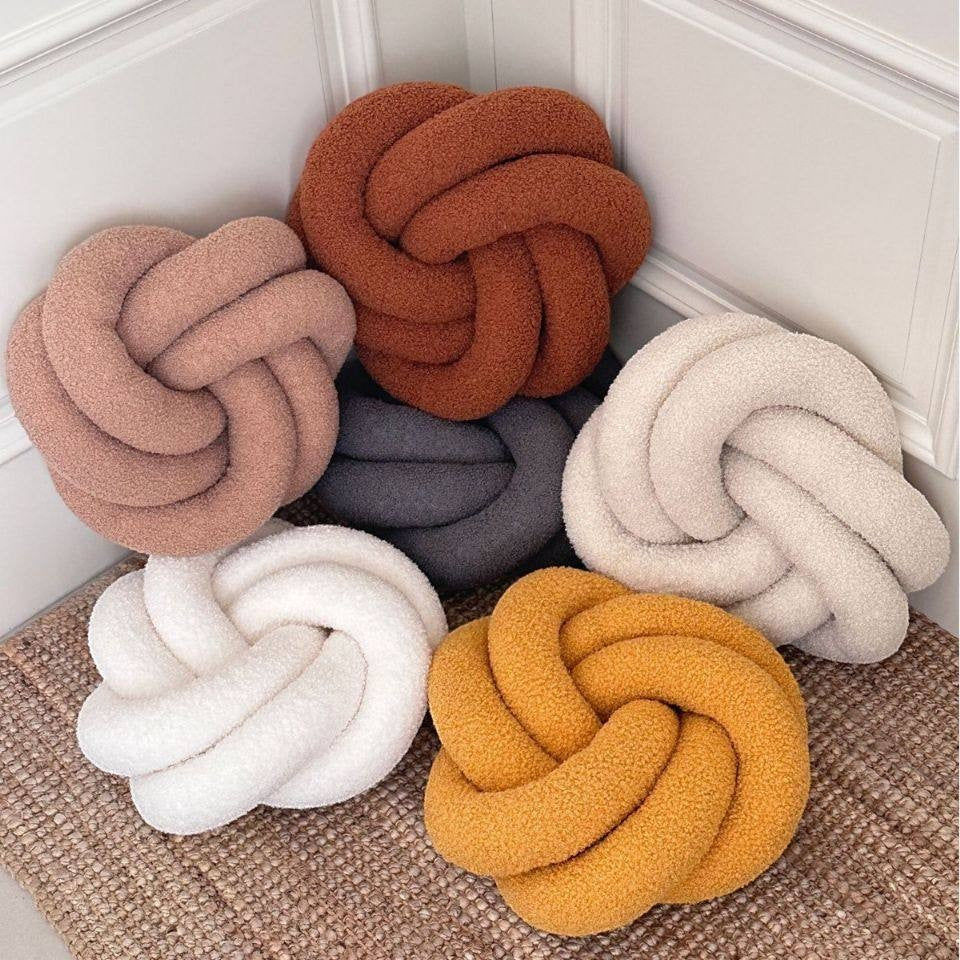 HOMELIVY Nordic knot cushion pillow in boucle fabric, available in rose, rust, charcoal, cream, white, and mustard yellow.