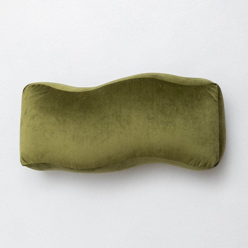 HOMELIVY muted olive green velvet bolster cushion with a sculptural wave shape.