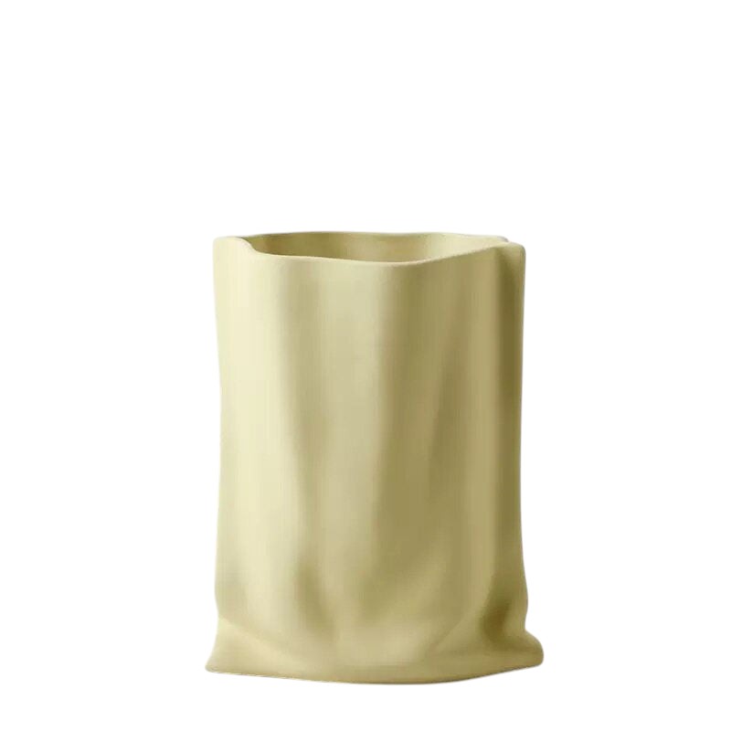 HOMELIVY pale yellow ceramic vase with a unique crinkled paper bag texture and modern minimalist design.