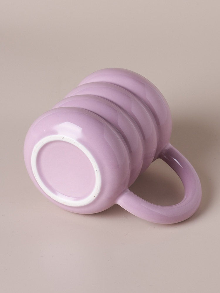 HOMELIVY pastel purple ceramic doughnut mug with a rounded ribbed design resting on its side