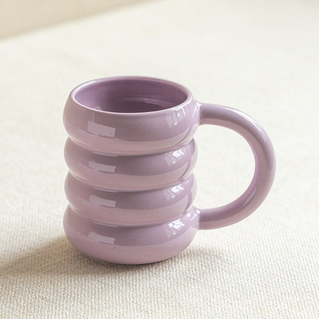 HOMELIVY pastel purple ceramic mug with a unique ribbed doughnut-inspired shape and a curved handle.