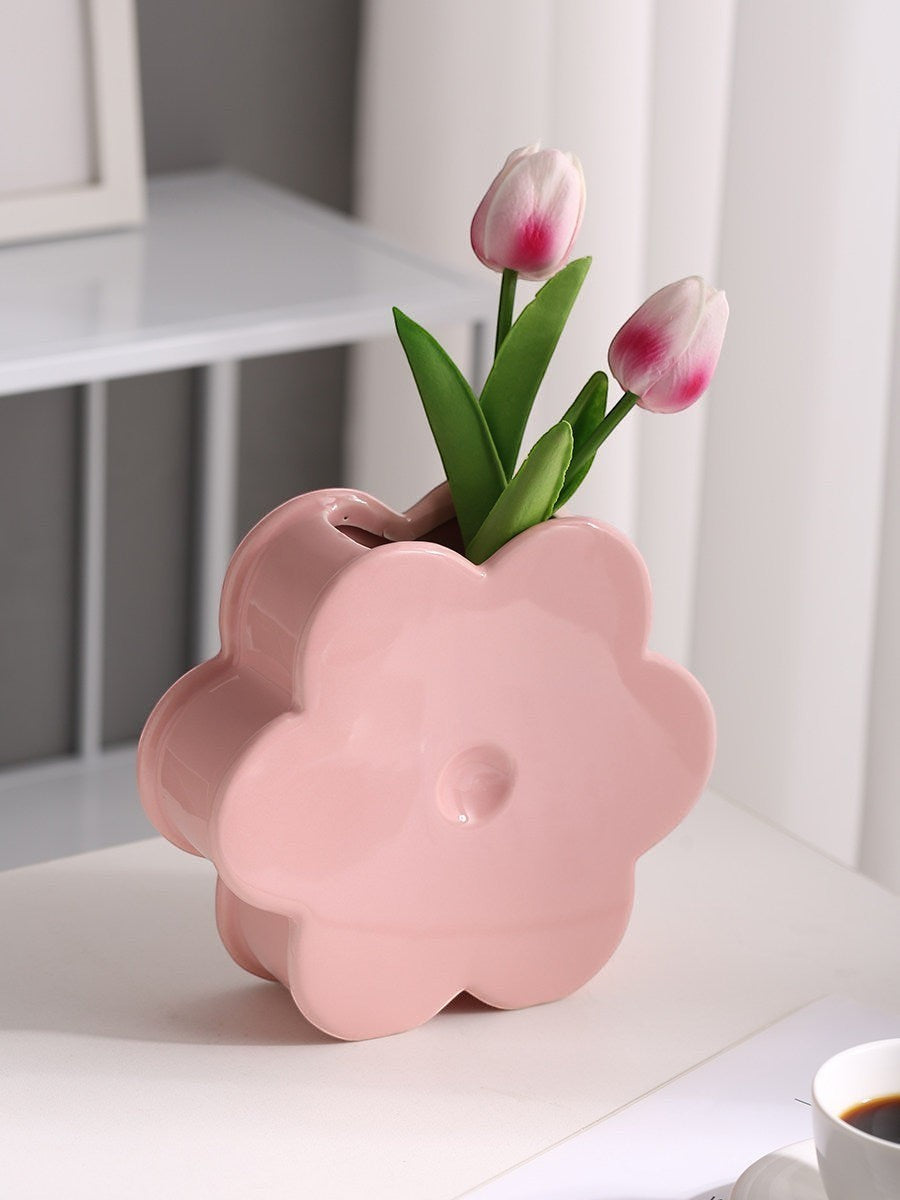 HOMELIVY light pink ceramic flower shaped vase holding two artificial tulips on a white table