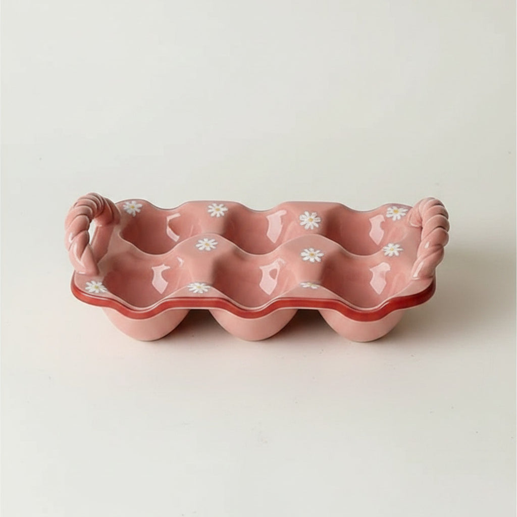 HOMELIVY pink ceramic egg crate featuring a charming daisy pattern and decorative twisted side handles.