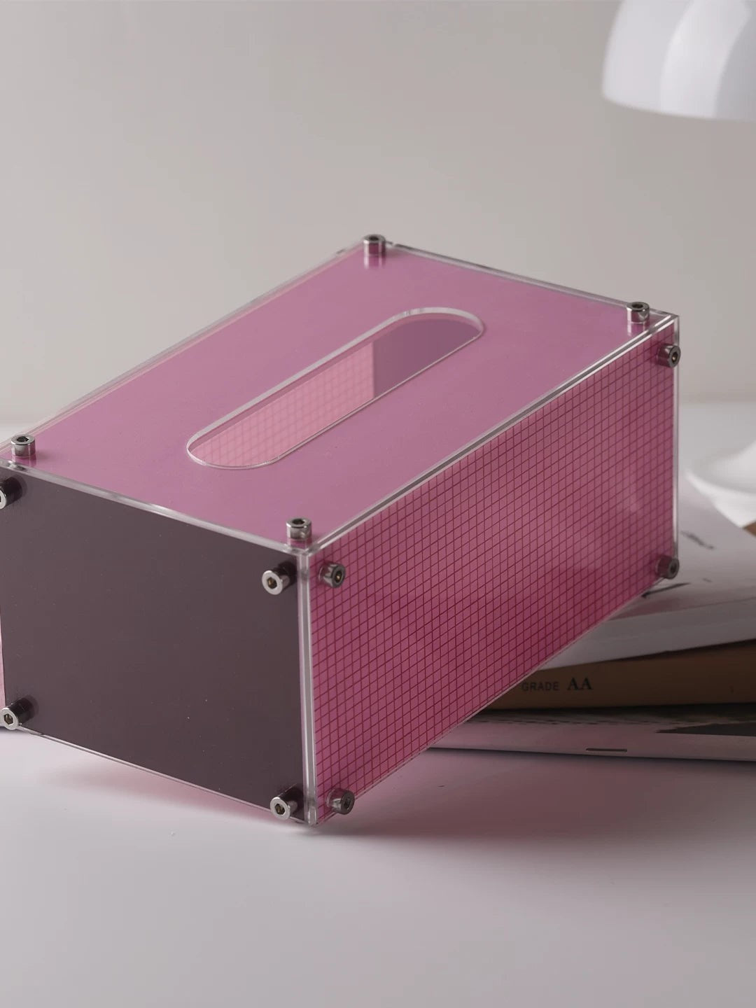HOMELIVY pink acrylic tissue box with a modern grid pattern and industrial metal screw accents on a white surface