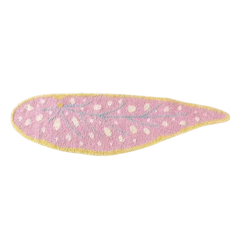 Pink leaf shaped rug with textured surface pink color yellow border and white polka dots for home decor